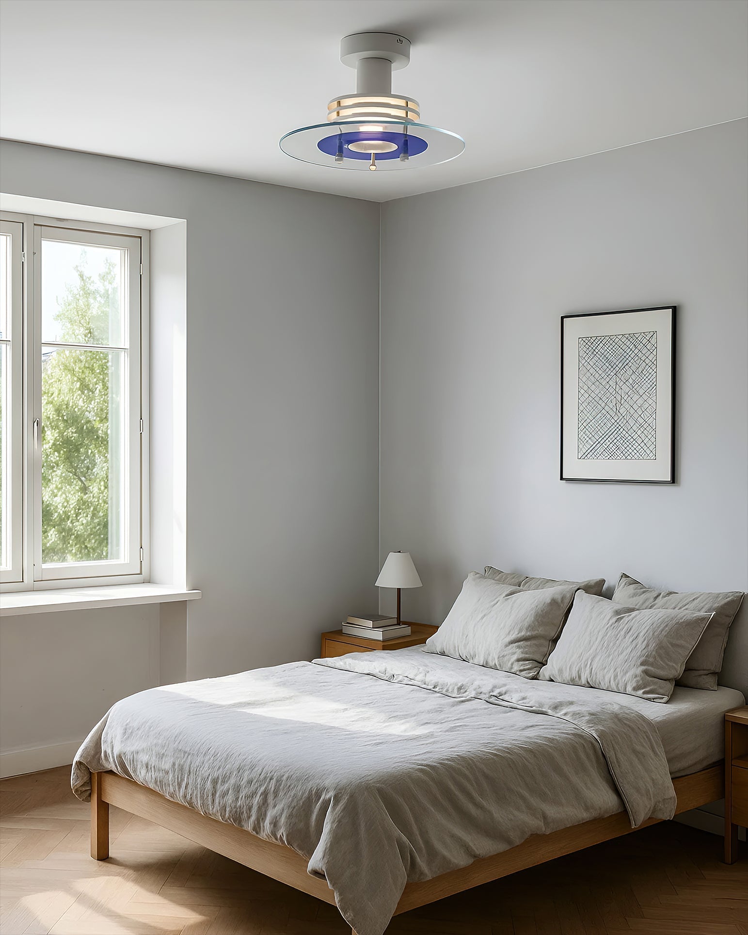 Nello Ceiling Lamp hanging over a dining table.