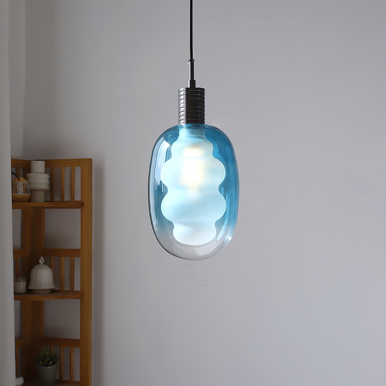 Close-up of the sculptural glass shade of the Niche Pendant Light.