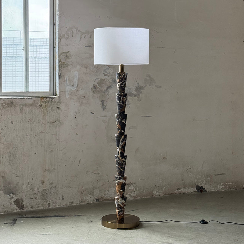A view of the lamp's base and marble column.