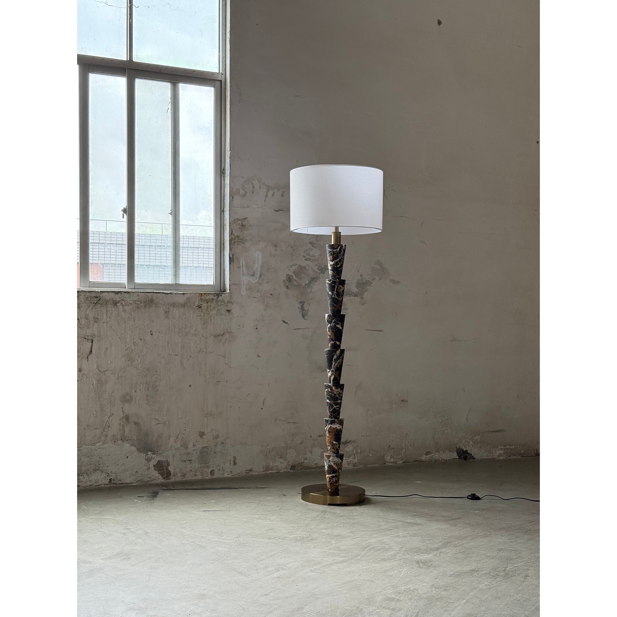 The gold metal accents on the Nizwa Floor Lamp.