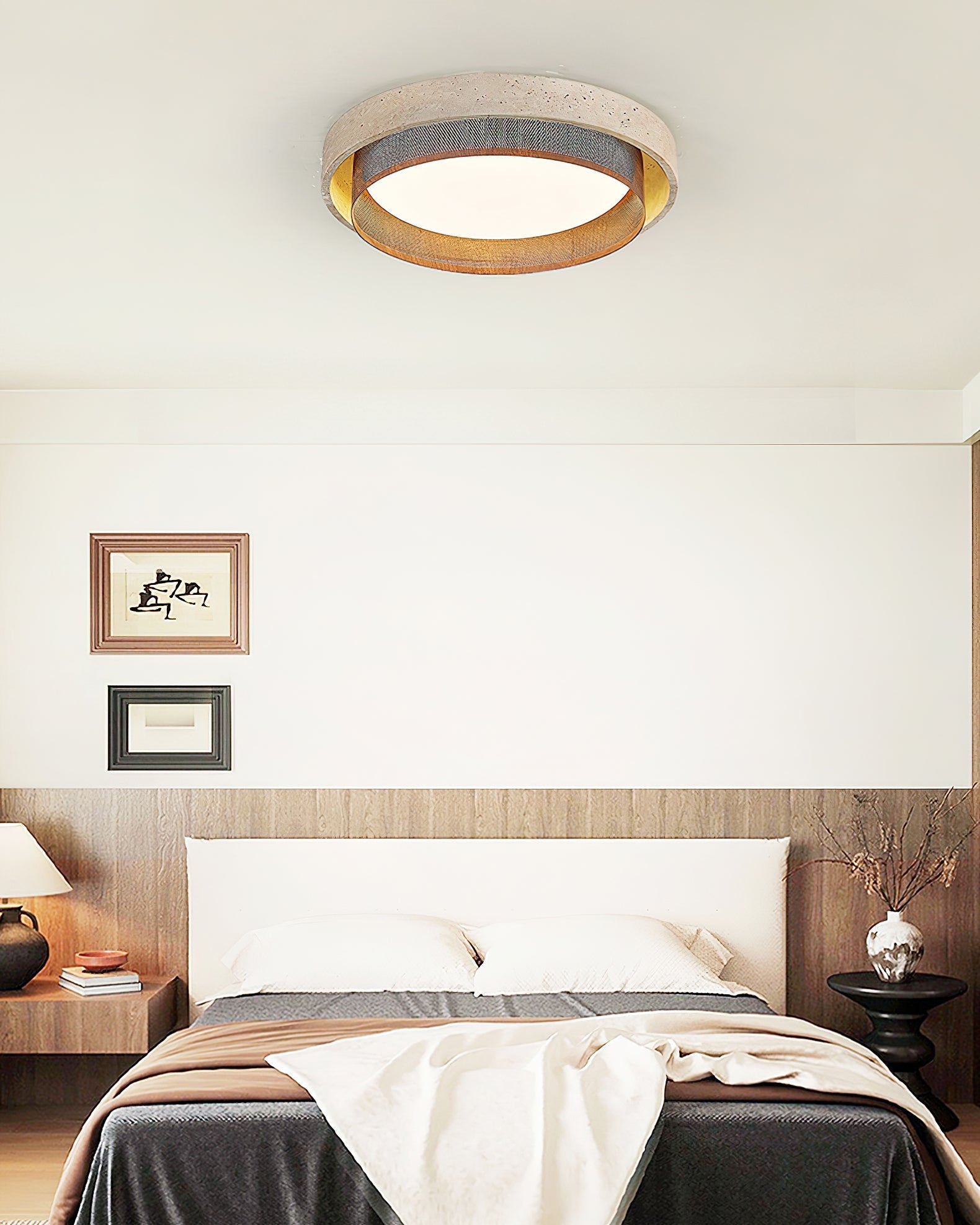 Side profile of the round Nolan ceiling light against a neutral wall.