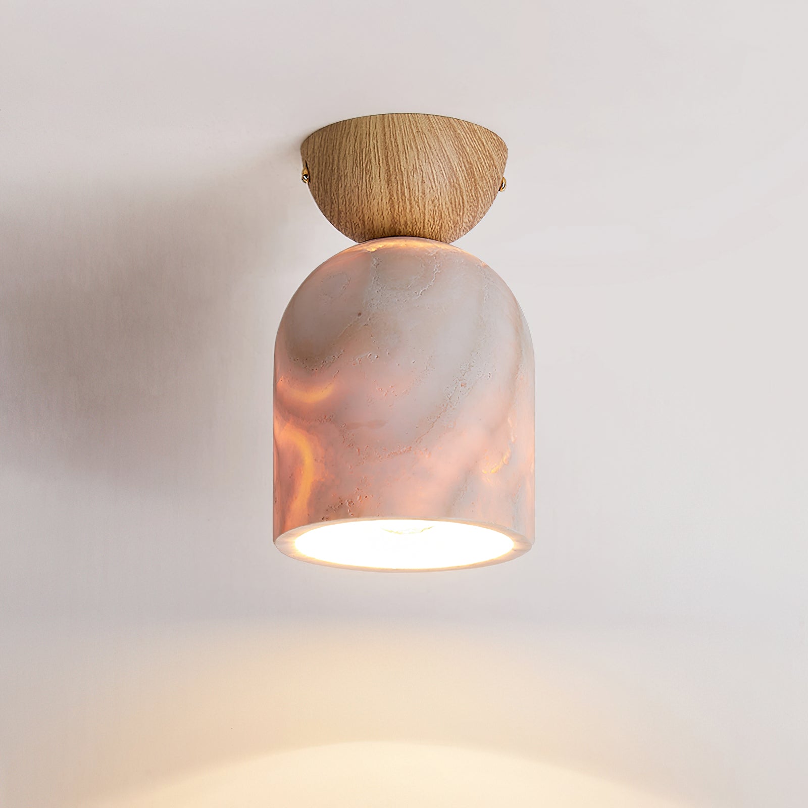 Close-up view of the Noncu lamp highlighting the travertine stone texture.