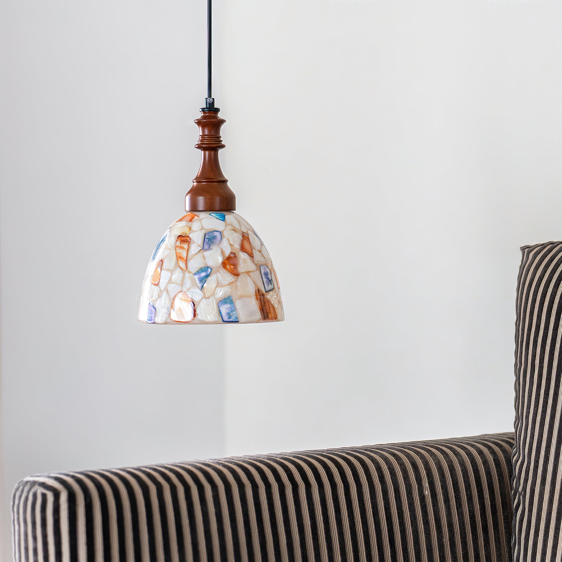 View of the ceiling mount and suspension wire for the Nonna Pendant Light.