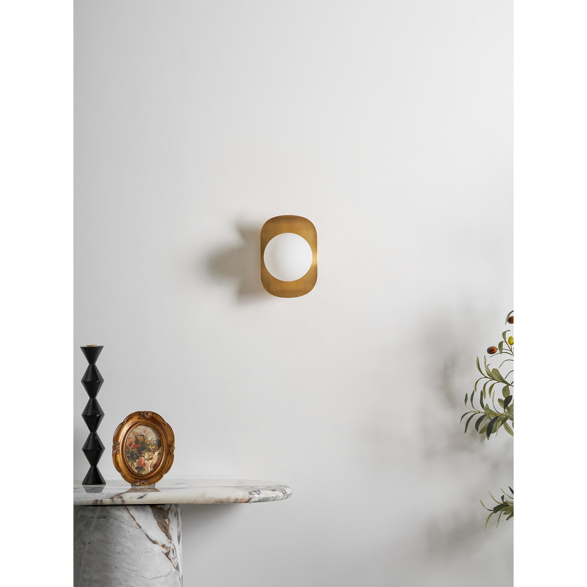 The Nouvel Wall Lamp mounted with the globe pointing upwards.