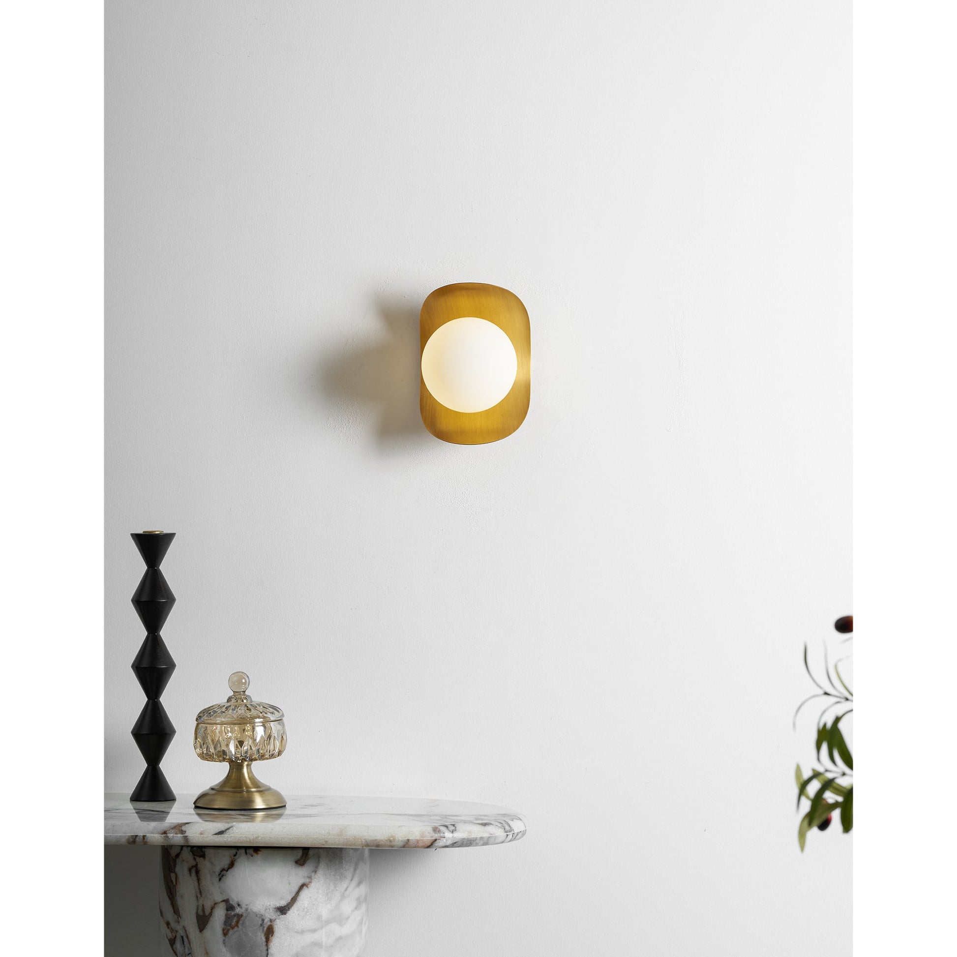 A pair of Nouvel Wall Lamps flanking a doorway in a hallway.