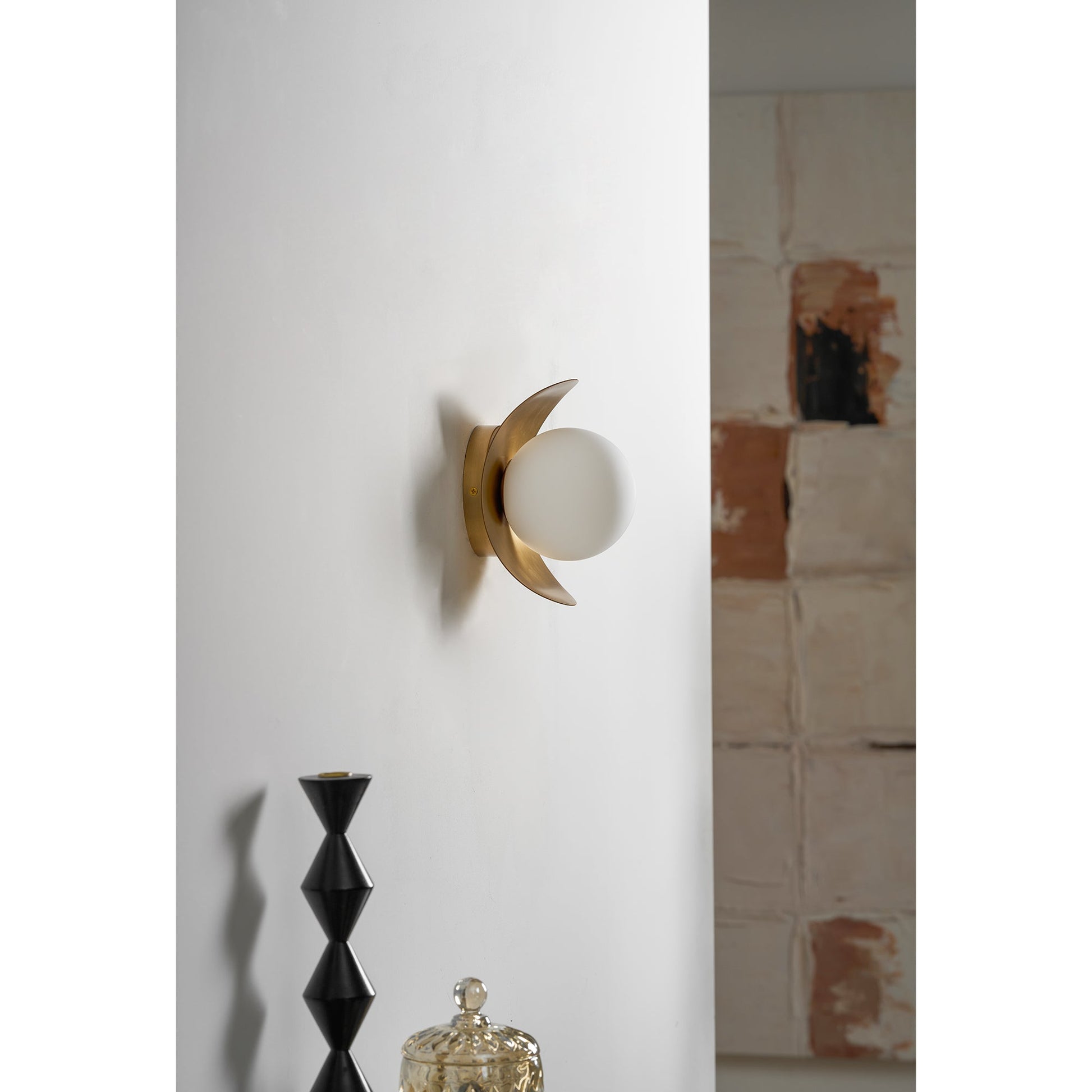 Lifestyle image of the Nouvel Wall Lamp in a contemporary hallway.
