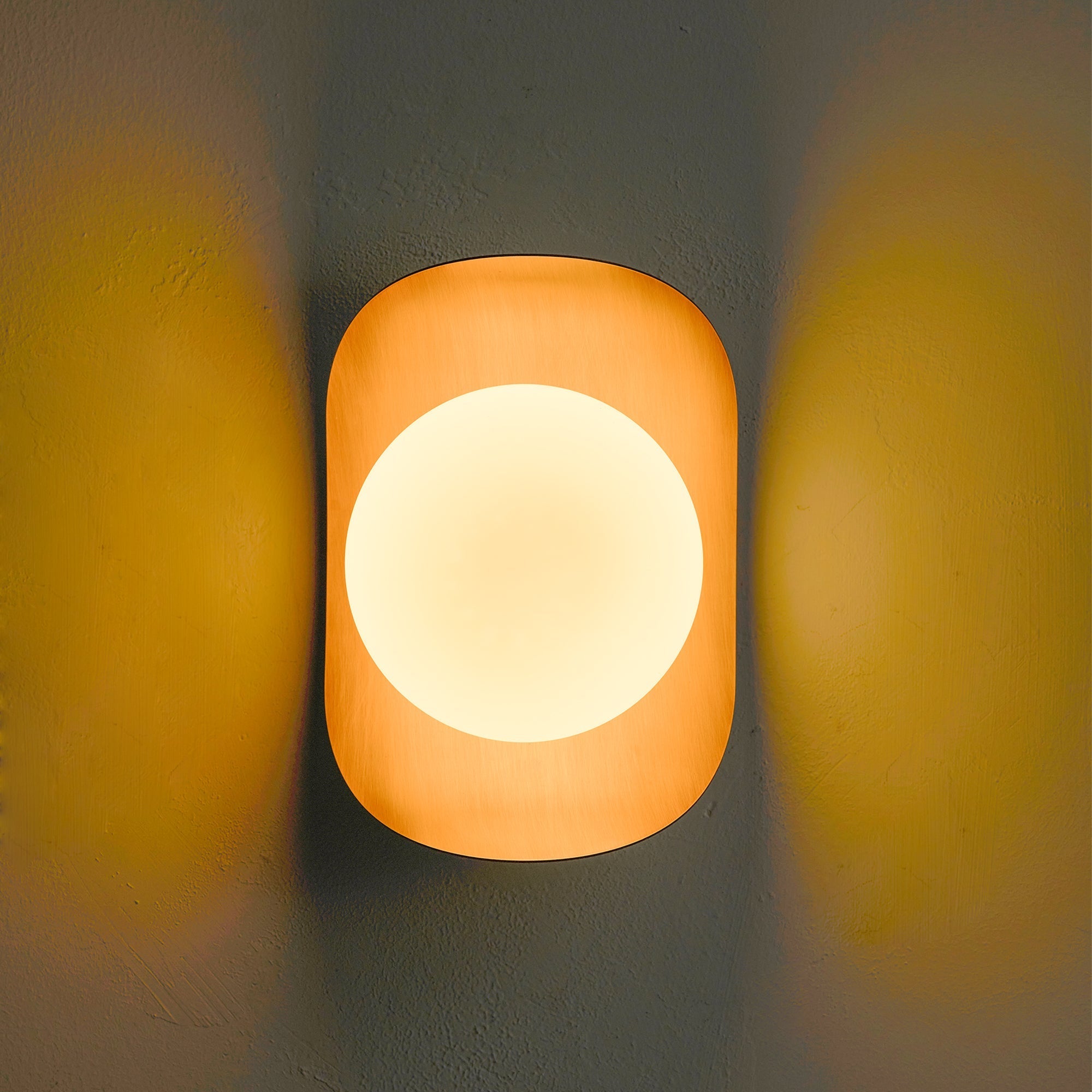 Angled view of the Nouvel Wall Lamp, highlighting its sculptural form.