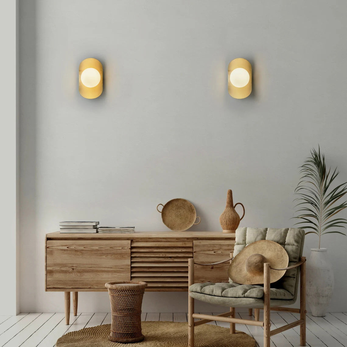 Nouvel Wall Lamp shown in a polished brass finish.