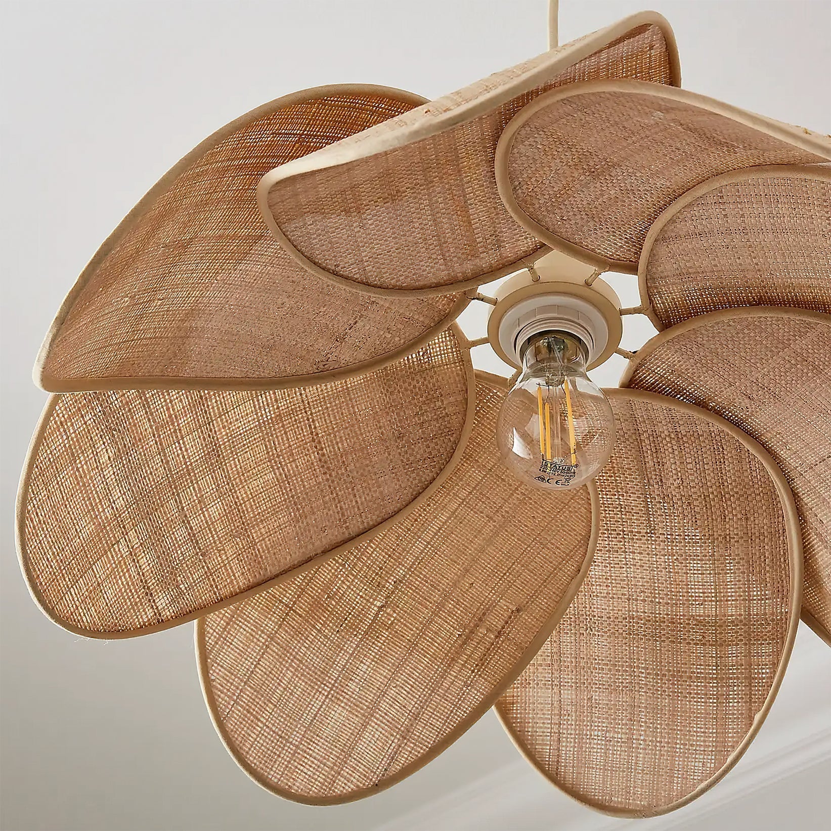 The natural texture and weave of the rattan material on the Odilia shade.