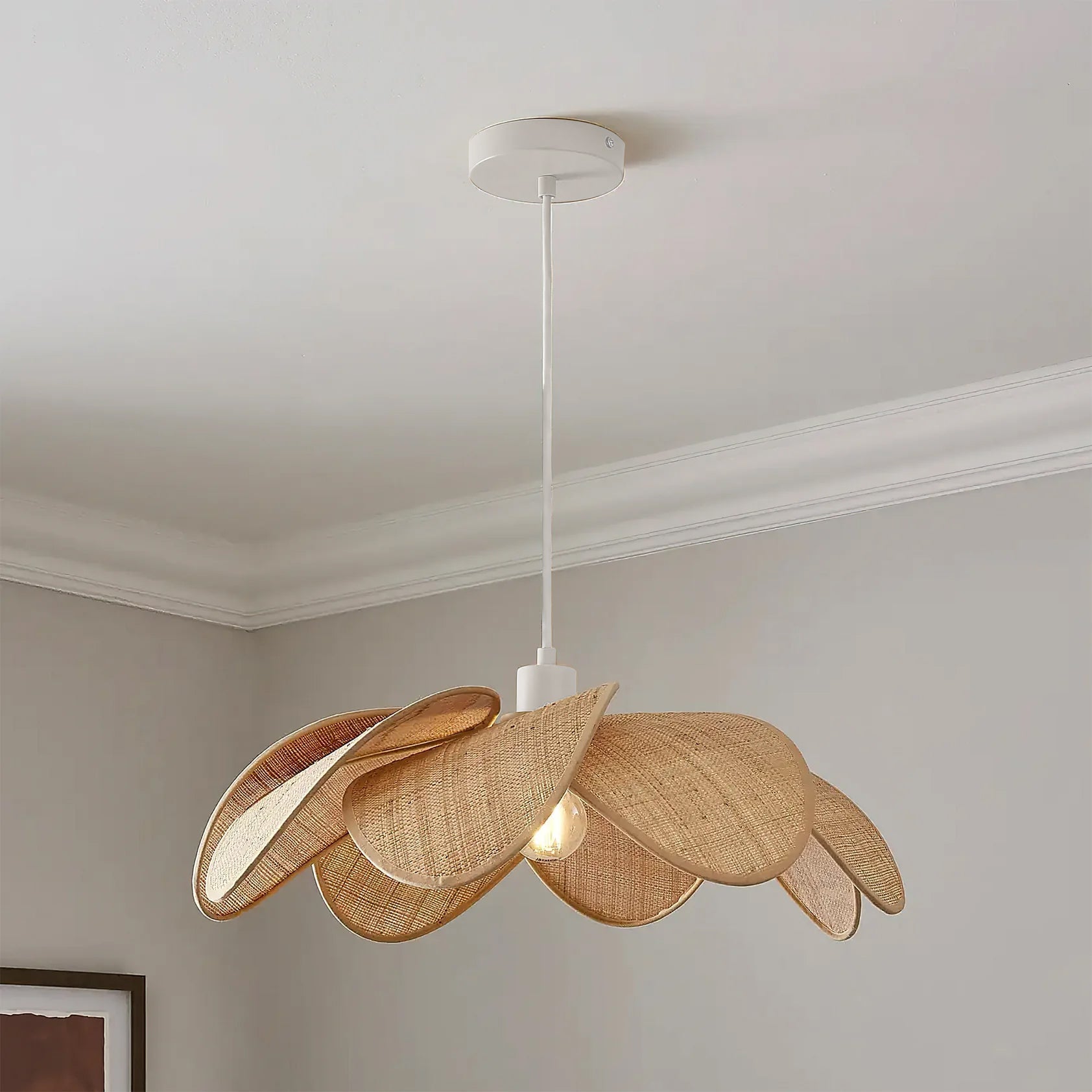 Close-up of the layered rattan petals on the Odilia Pendant Light.