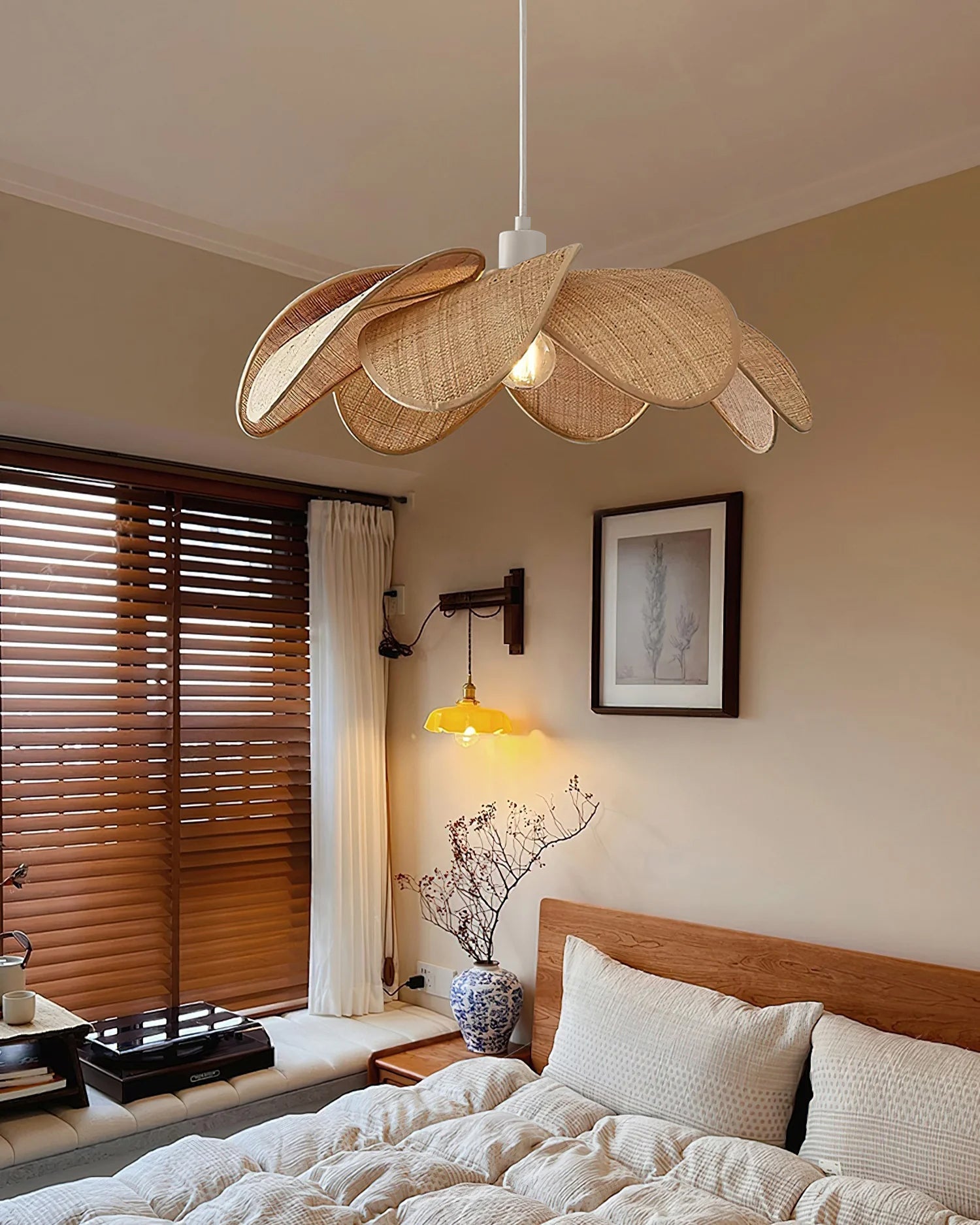Detail view of the metal fixture and natural rattan shade.