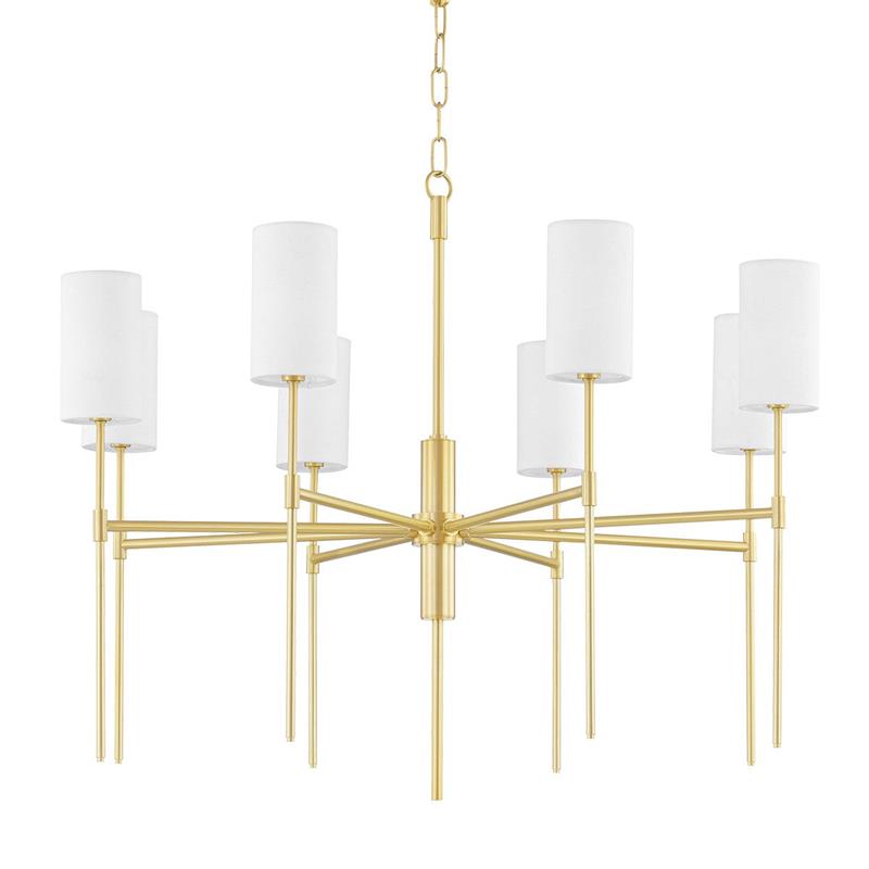 Lifestyle image of the Olivia Chandelier hanging above a dining table.