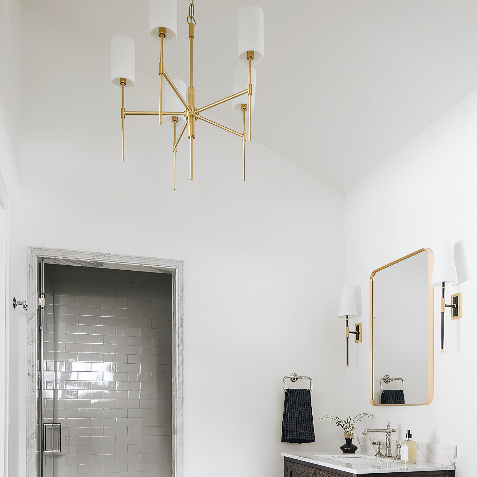 Close-up view of the Olivia Chandelier's fabric lampshade and brass arm.