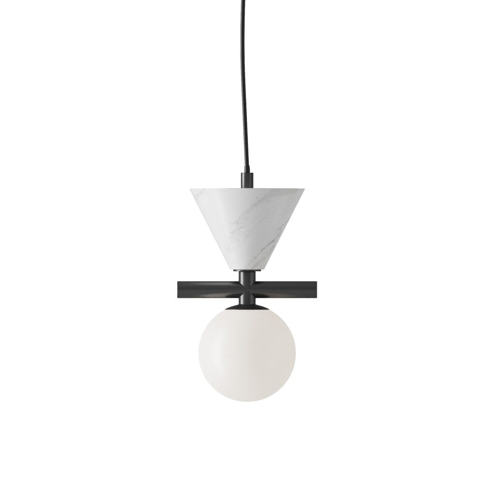 Oneta Pendant Lamp hanging over a dining table.