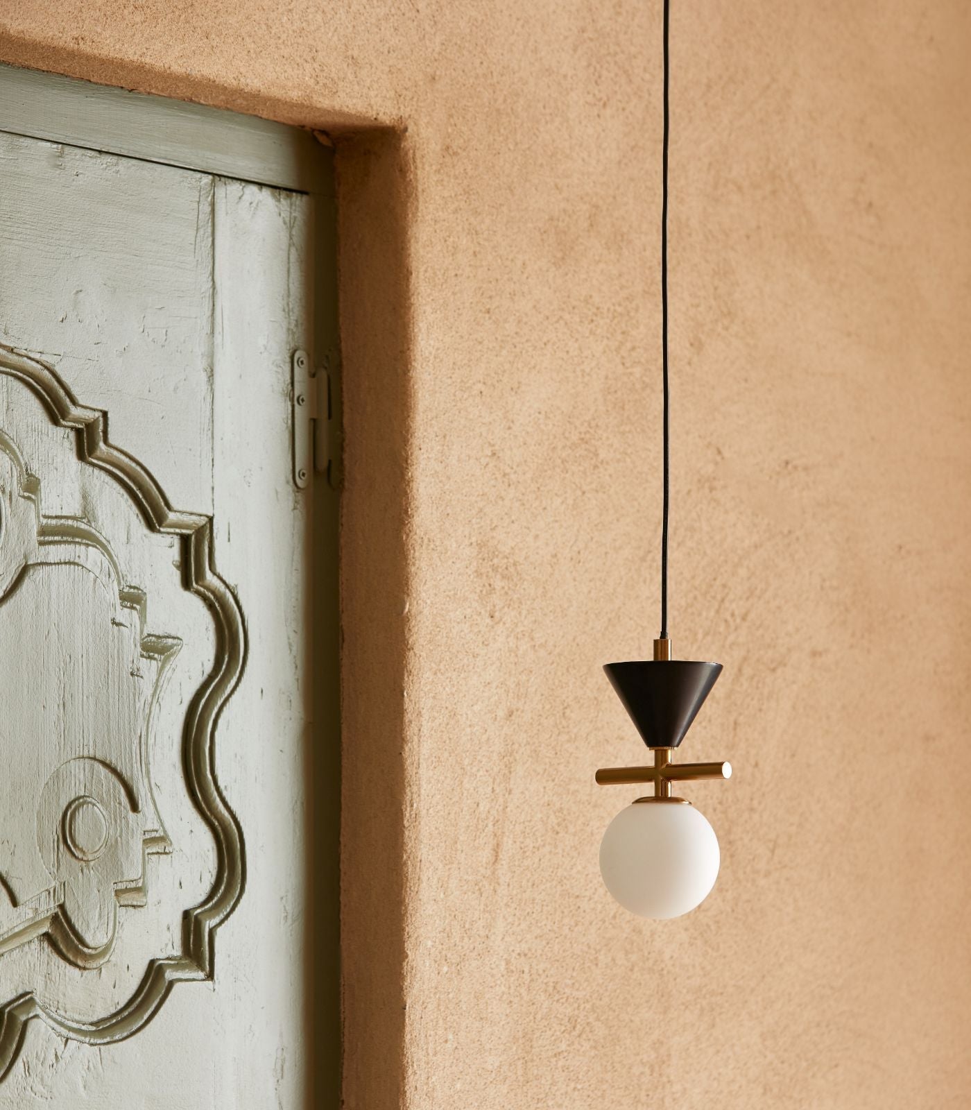 Close-up view of the Oneta Pendant Lamp's marble and glass details.