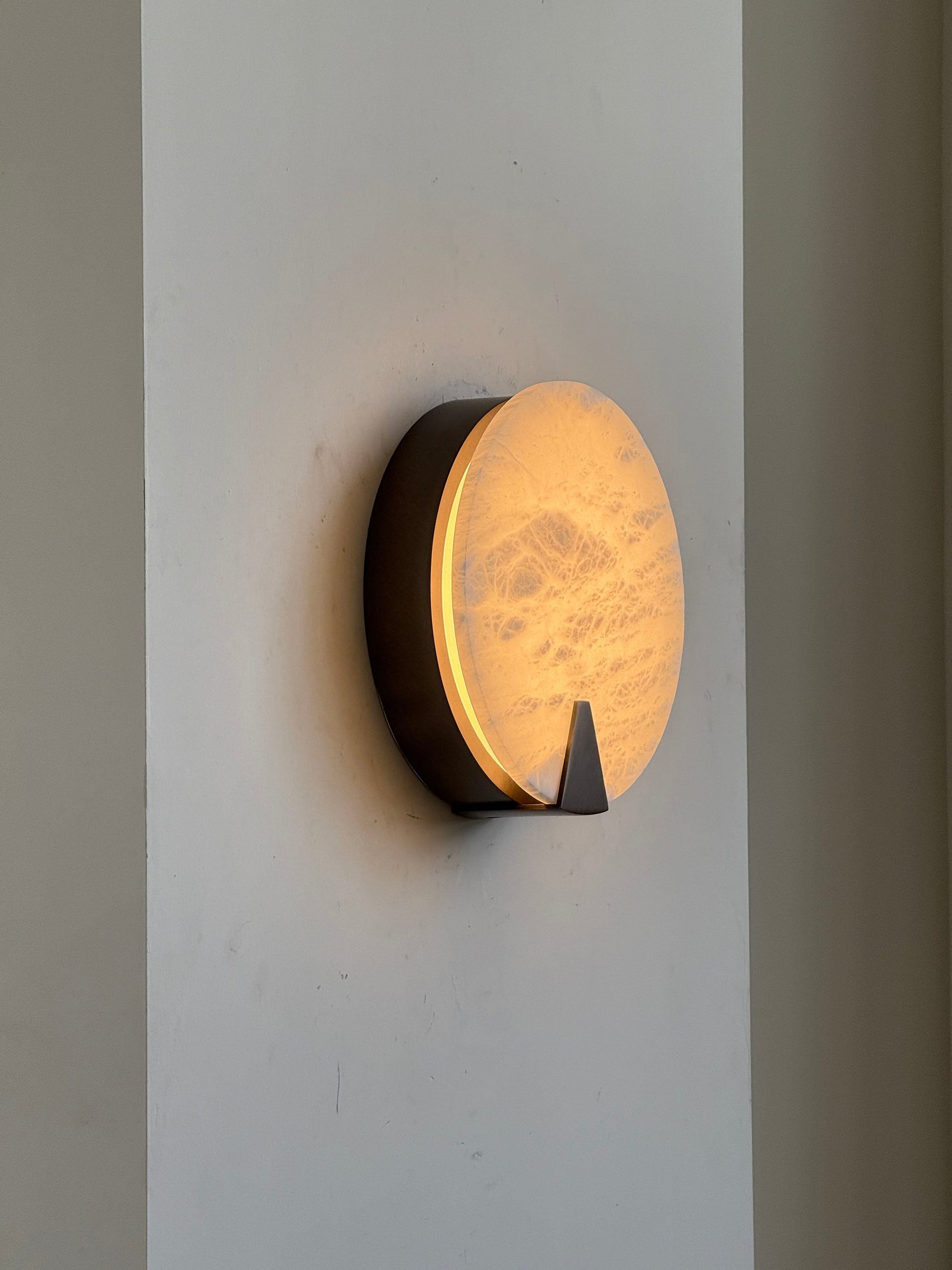 View from below the Ophelia Sconce, showing its circular form.