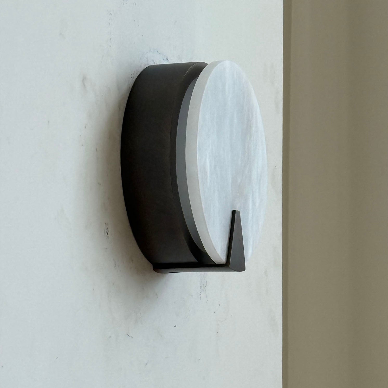 A pair of Ophelia Sconces installed in a contemporary hallway.