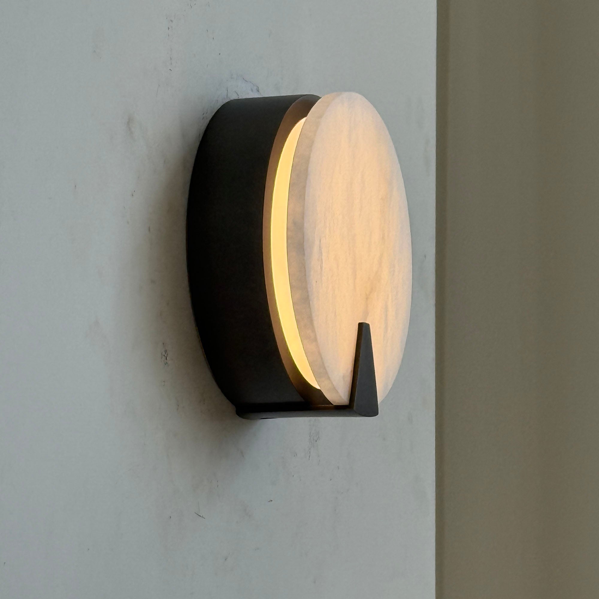 Side profile of the Ophelia Alabaster Sconce showing its slim 6cm width.