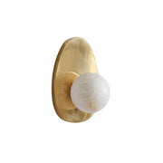 Orba Alabaster Wall Sconce with brass body, front view on a neutral background.