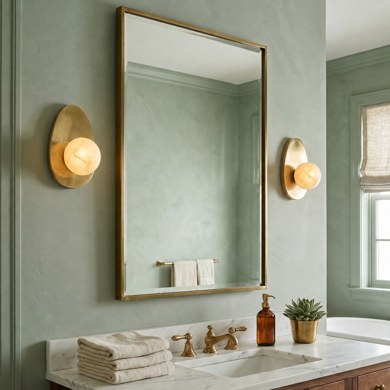 Angled view of the Orba Alabaster Wall Sconce showing the round shade.