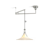 Orient Swing Arm Pendant Light hanging over a dining table.