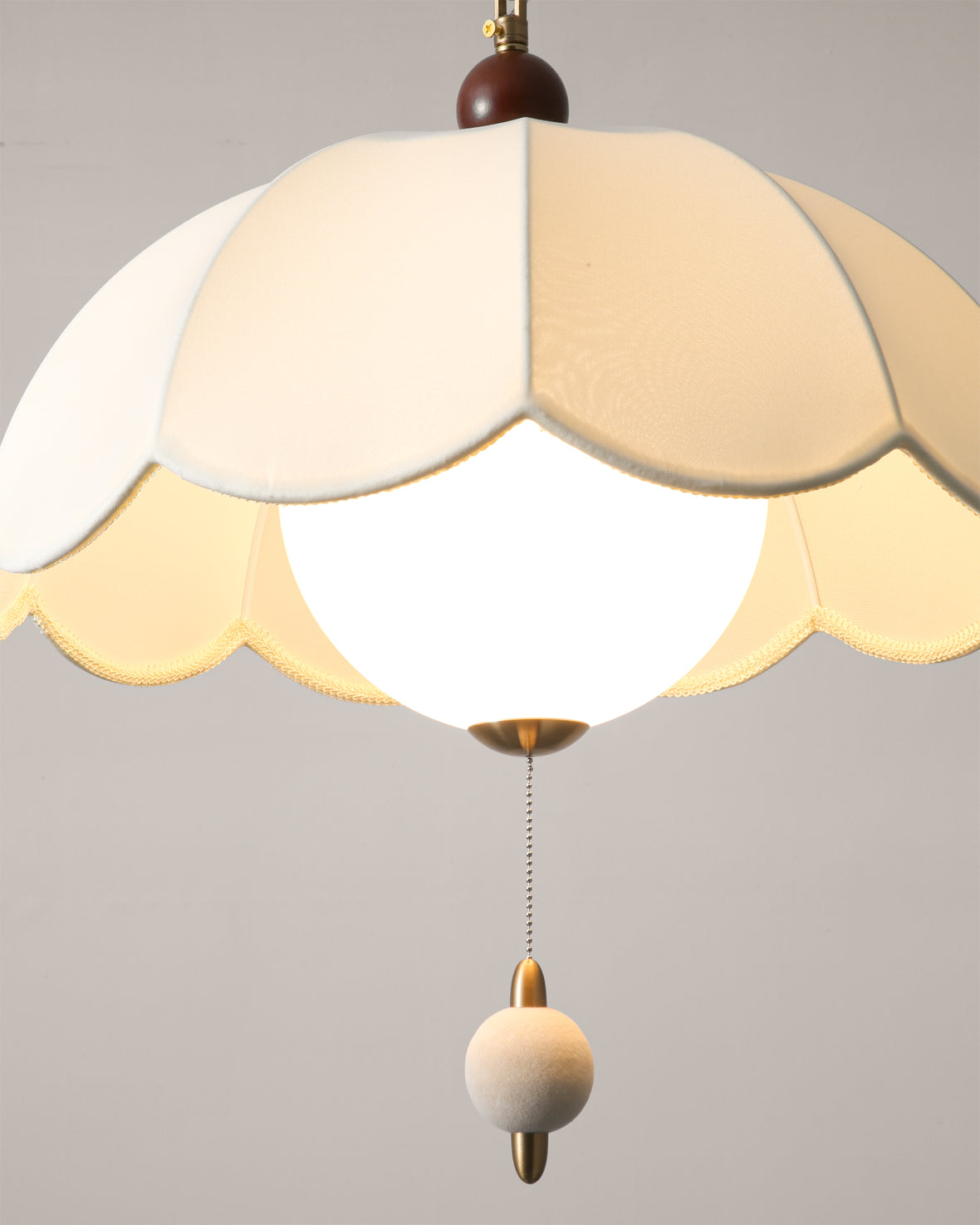 The larger size (23.6") Oriente Pendant Light shown to scale.