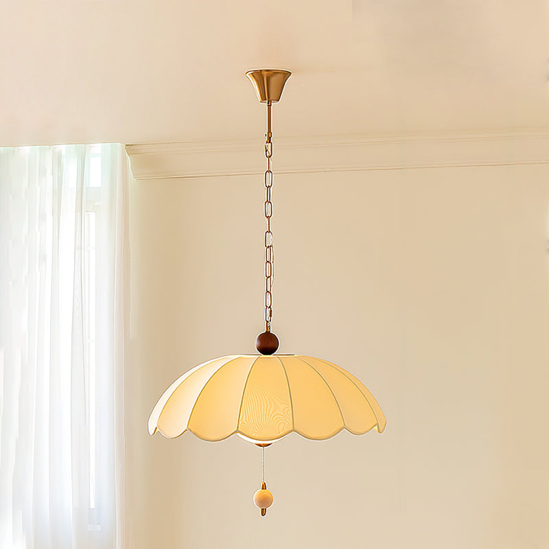 Lifestyle image of the Oriente Pendant Light in a bedroom setting.