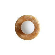 Orli Yellow Onyx Sconce with a central glass globe.