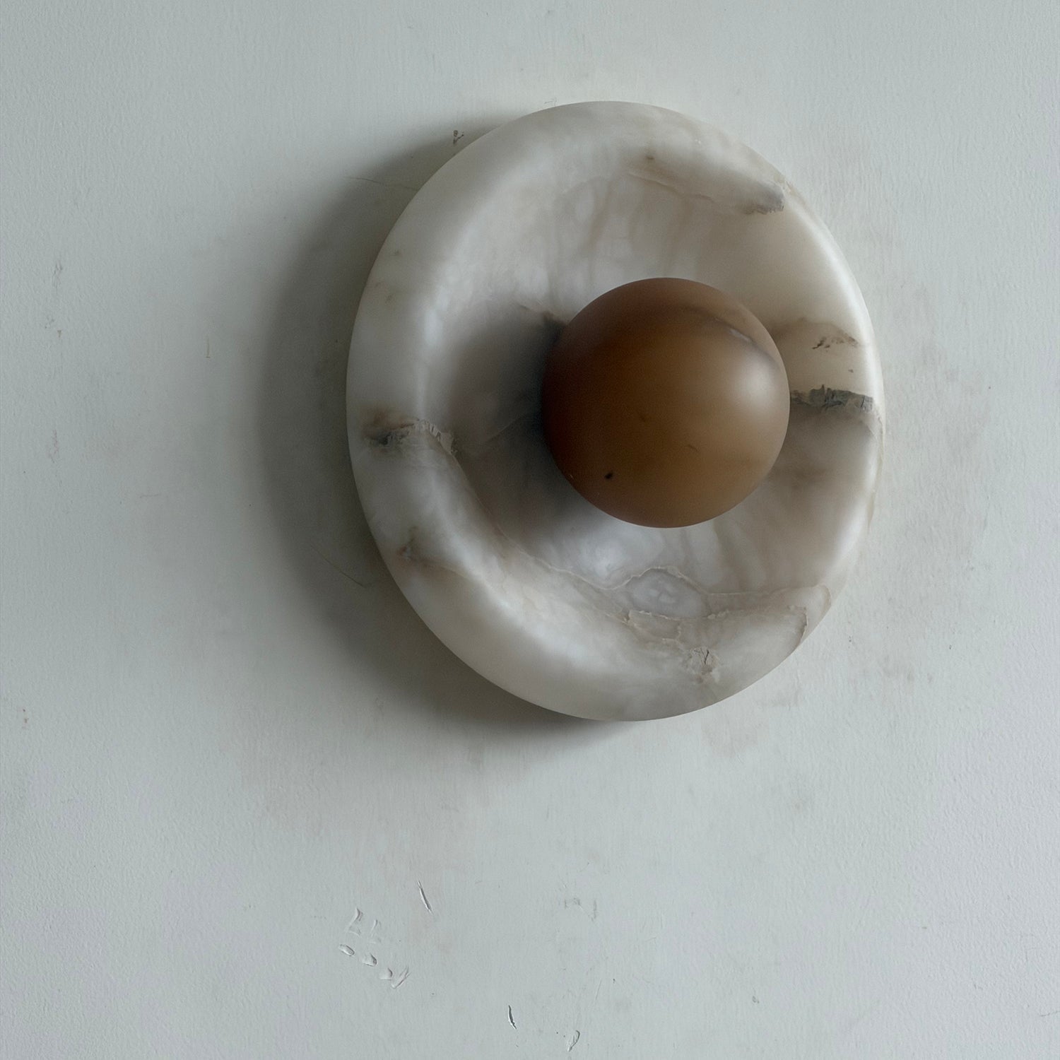 Lifestyle image showcasing the ambient light from the Orli lamp.