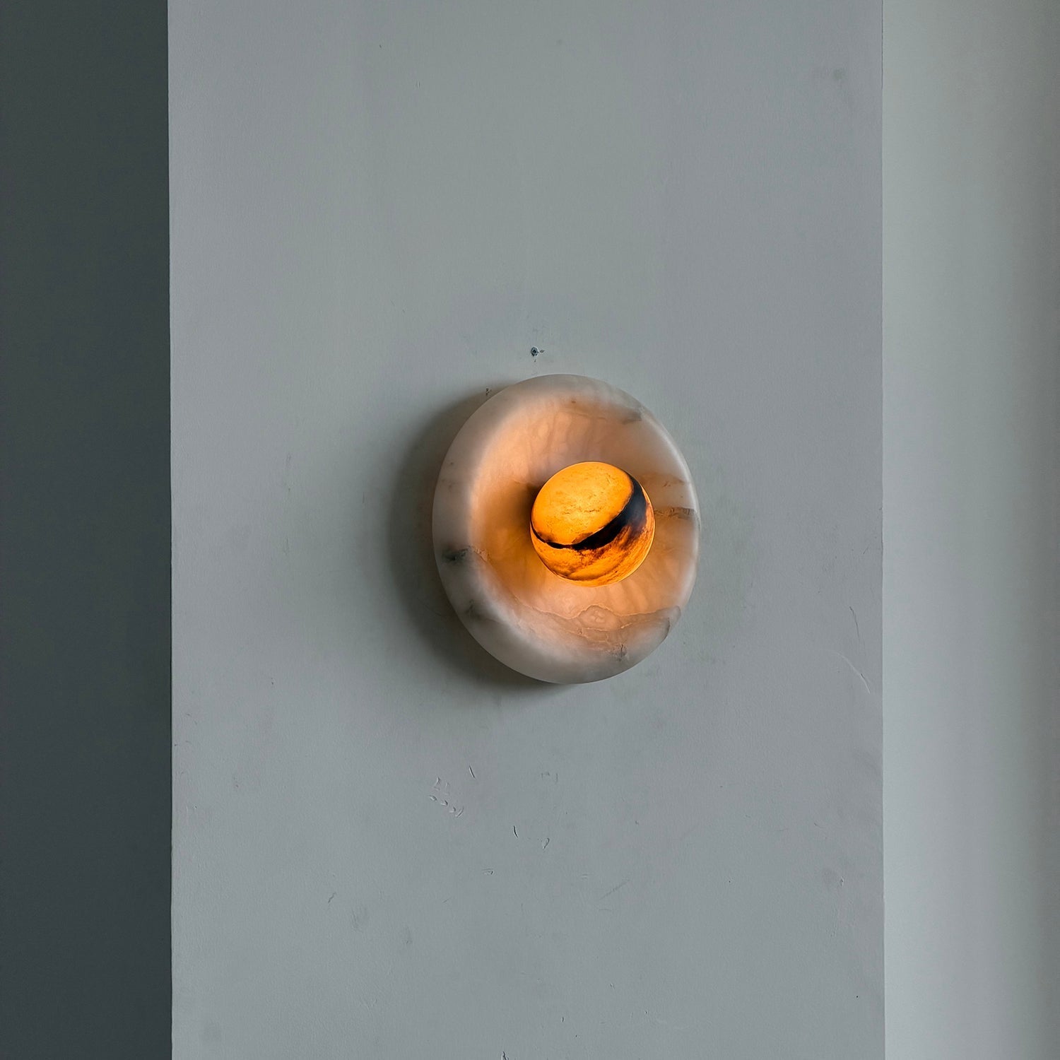 The translucent quality of the alabaster stone when lit.