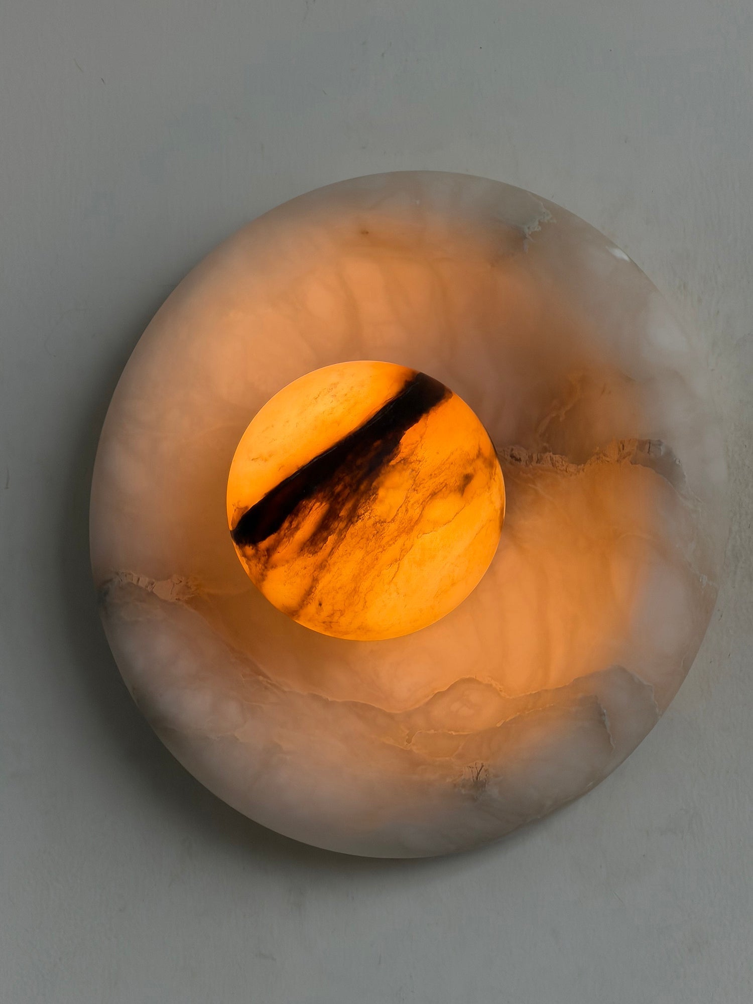 Orli Alabaster Wall Lamp as a functional art piece.