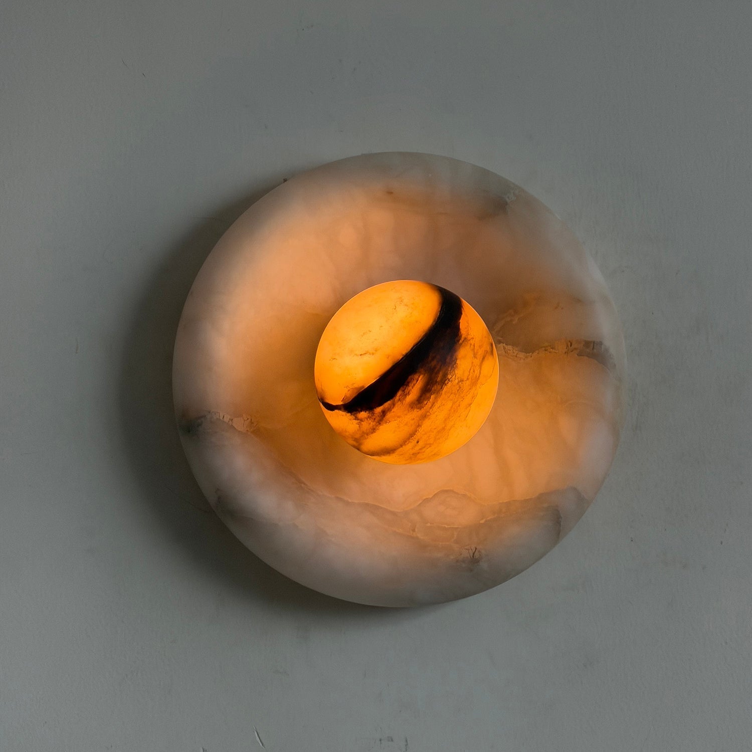 Close-up of the natural alabaster veining on the Orli Wall Lamp.