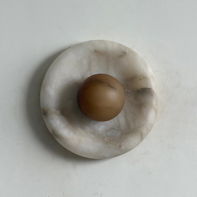 Deep tobacco Orli Wall Lamp adding warmth to a study.