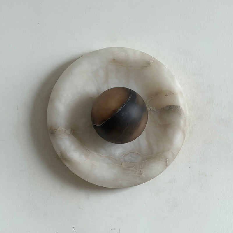Orli Wall Lamp showcasing its minimalist circular design.