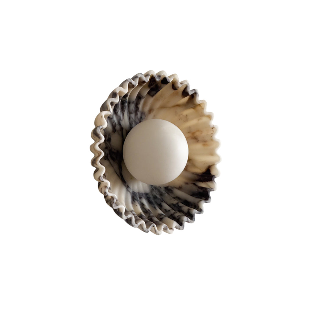 Unlit Ostro Sconce in green marble, highlighting the material.