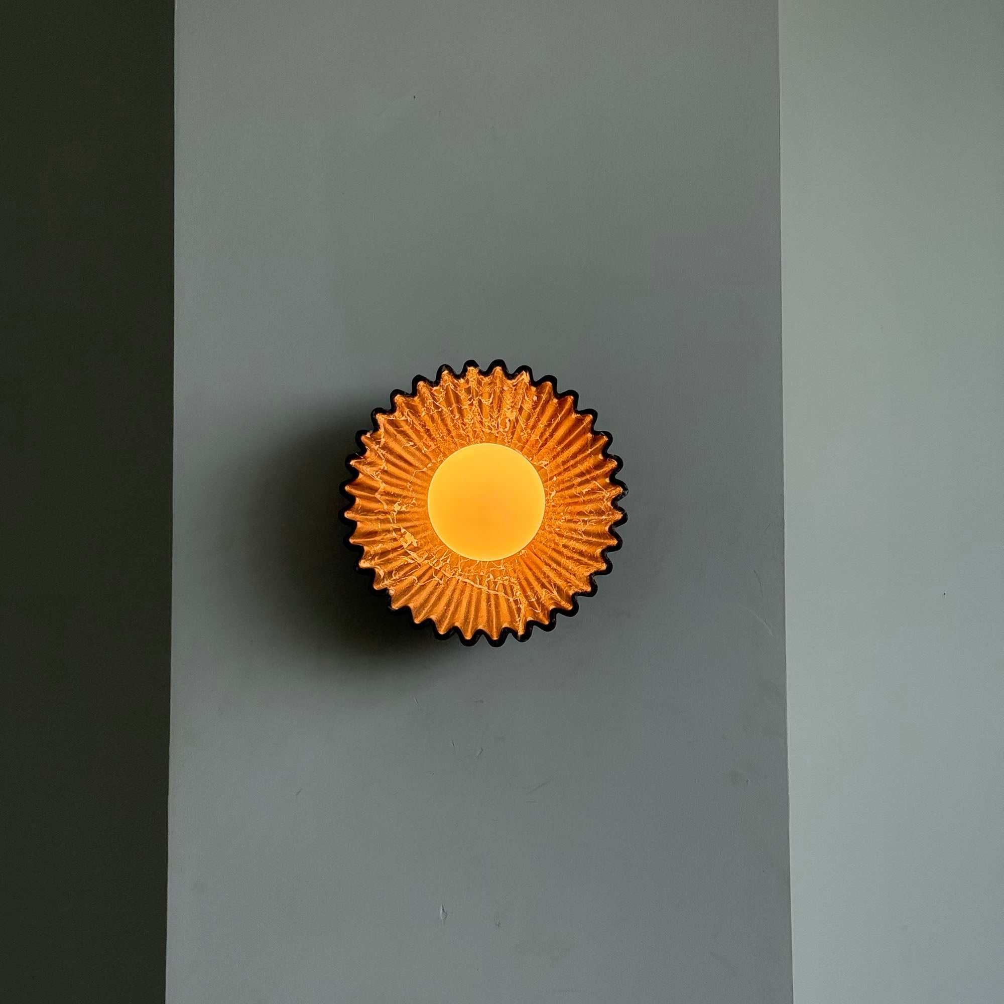 Ostro Marble Small Sconce in purple, shown against a light wall.