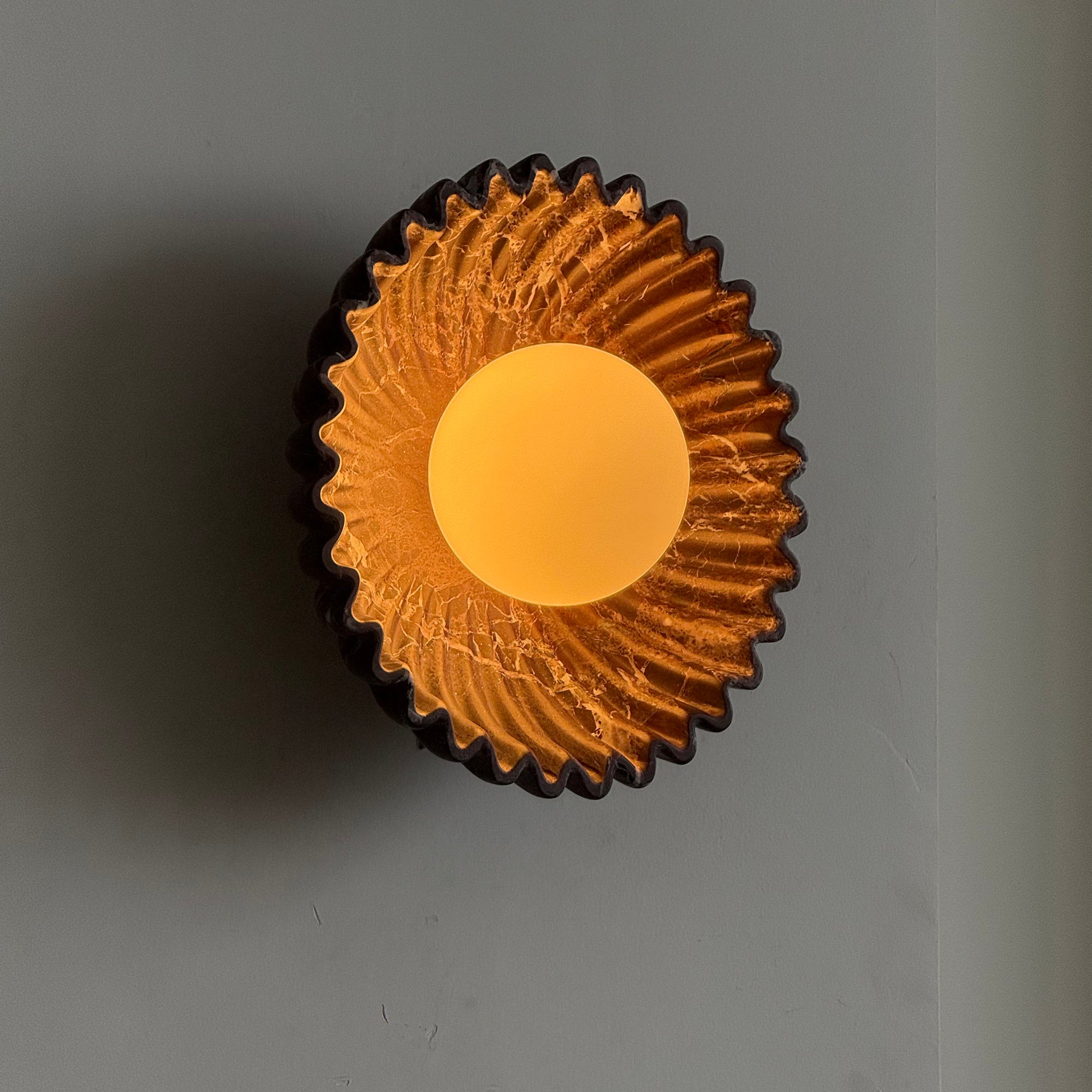 Ostro Sconce in a hallway, providing ambient lighting.