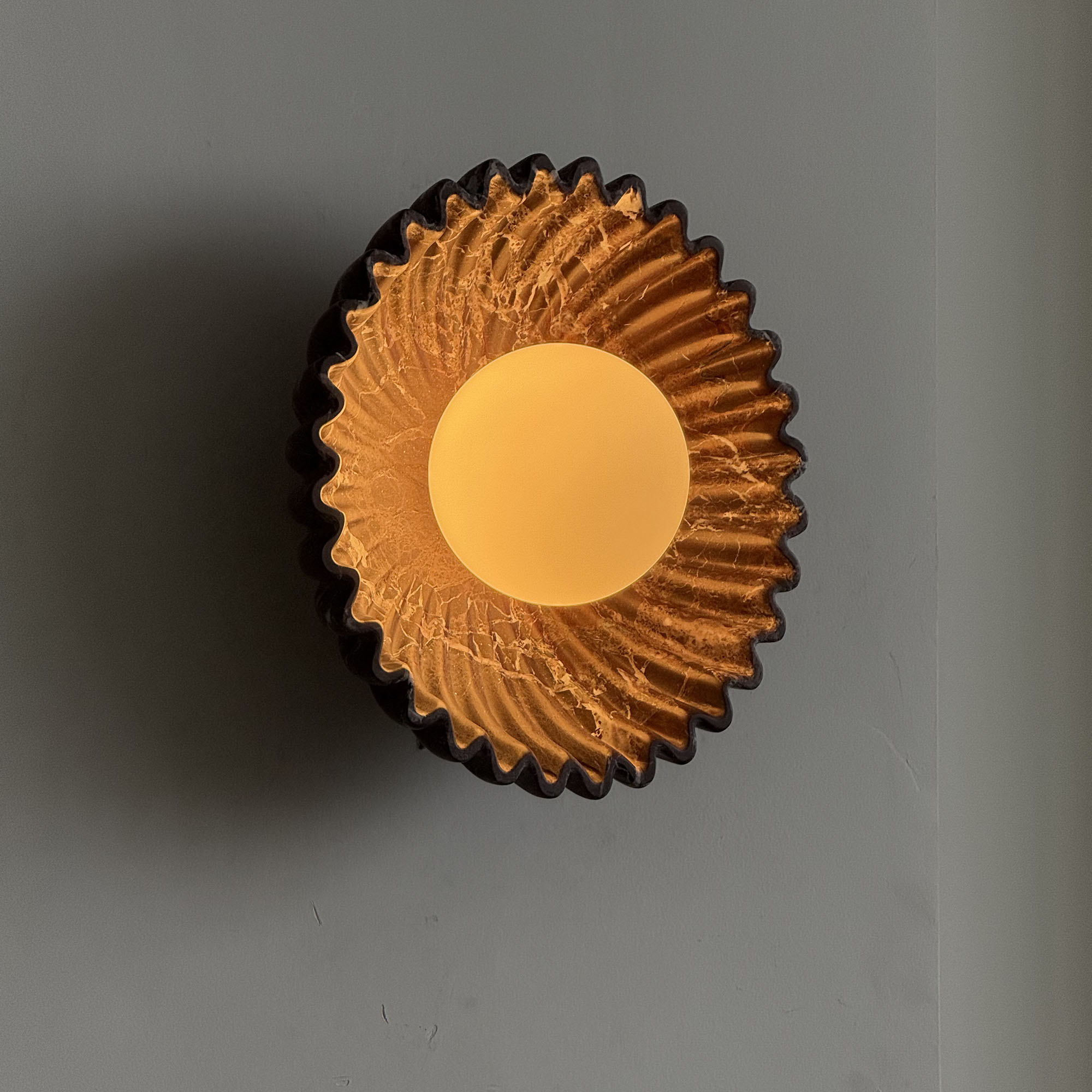 Ostro Sconce in a hallway, providing ambient lighting.