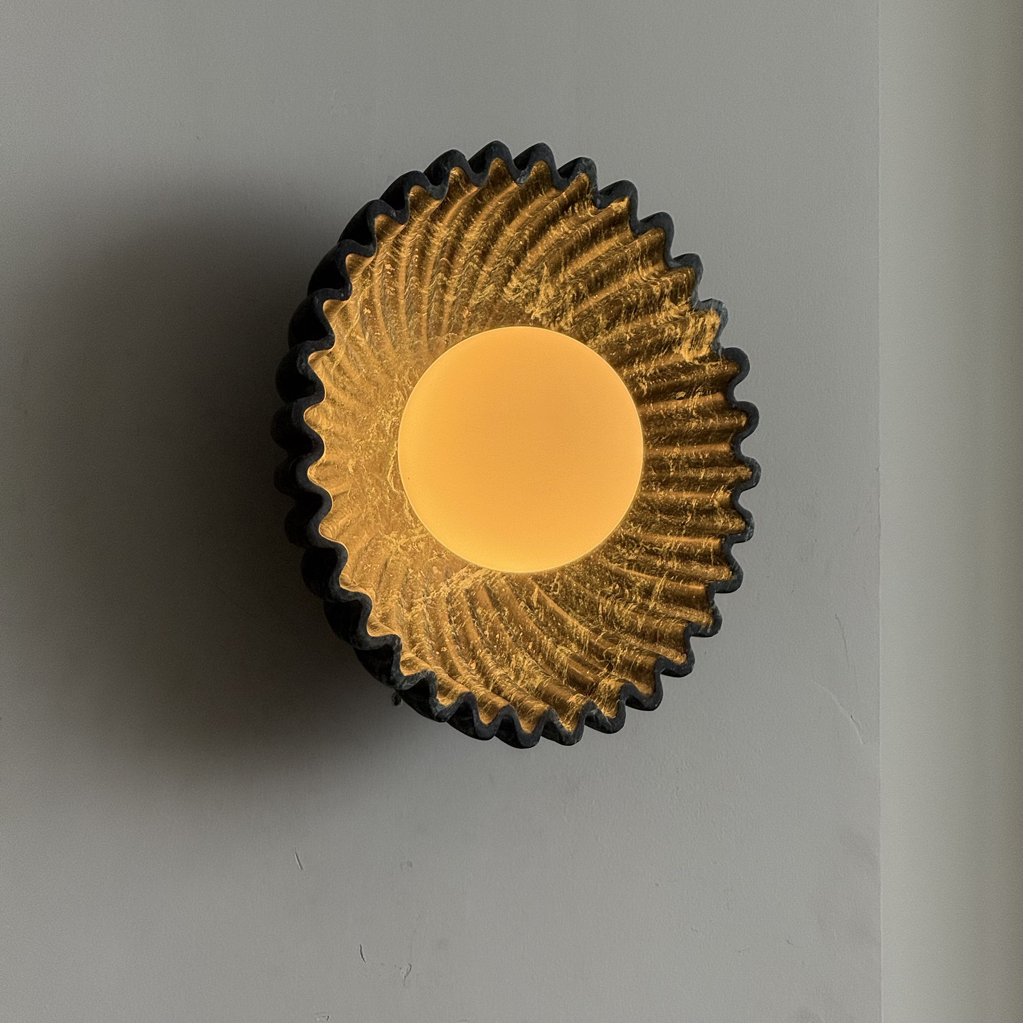 Unlit Ostro Sconce in white marble, showcasing its form.