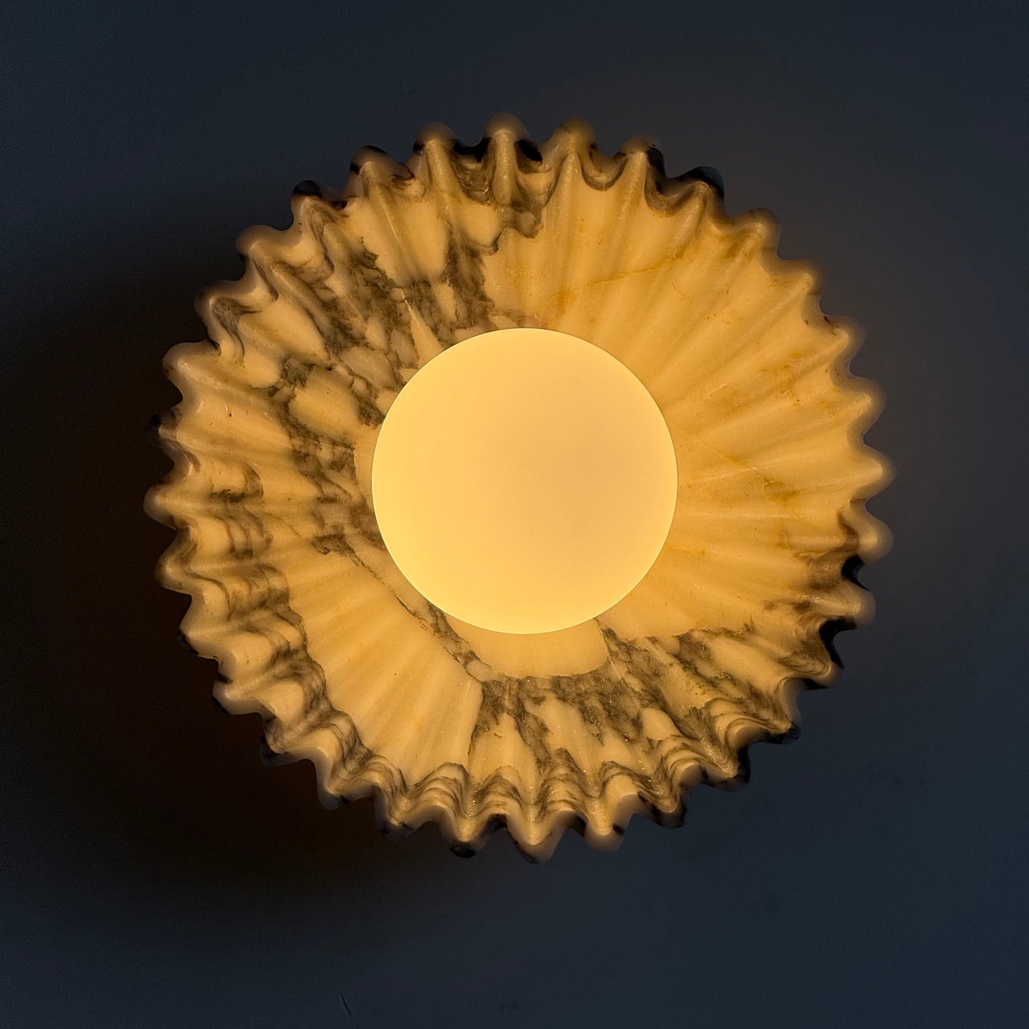 Close-up of the white marble veining on the Ostro Sconce.