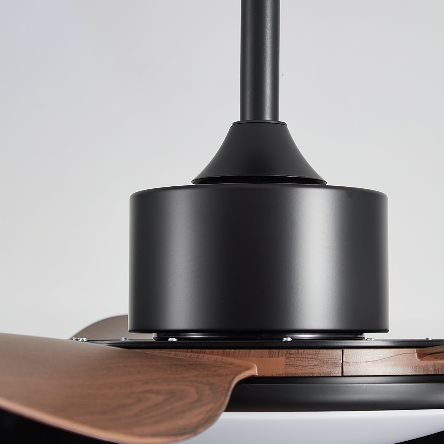 Angled view of the walnut finish Ovlaim ceiling fan.