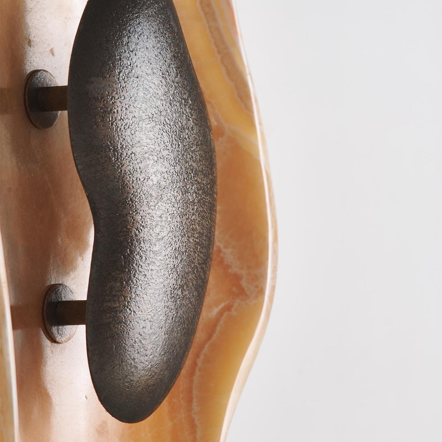 Back view of the sconce showing the mounting plate.