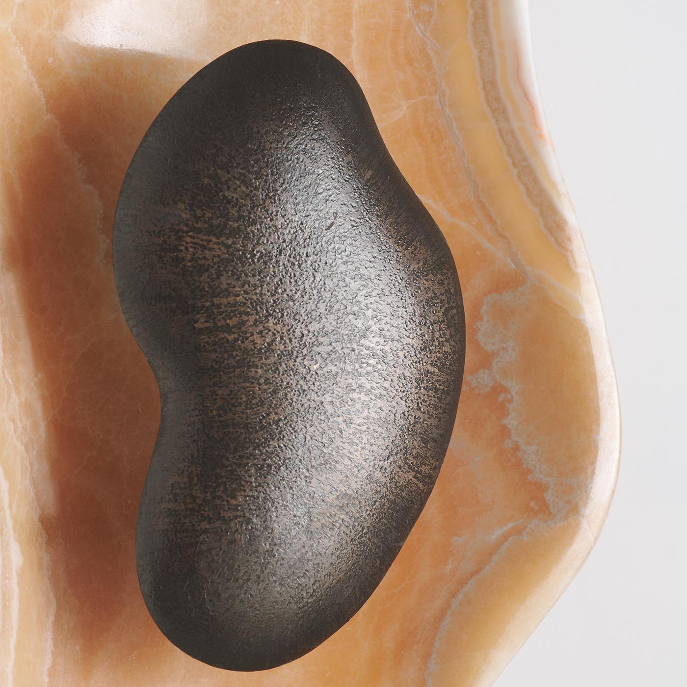 Detail of the connection between the brass and onyx components.