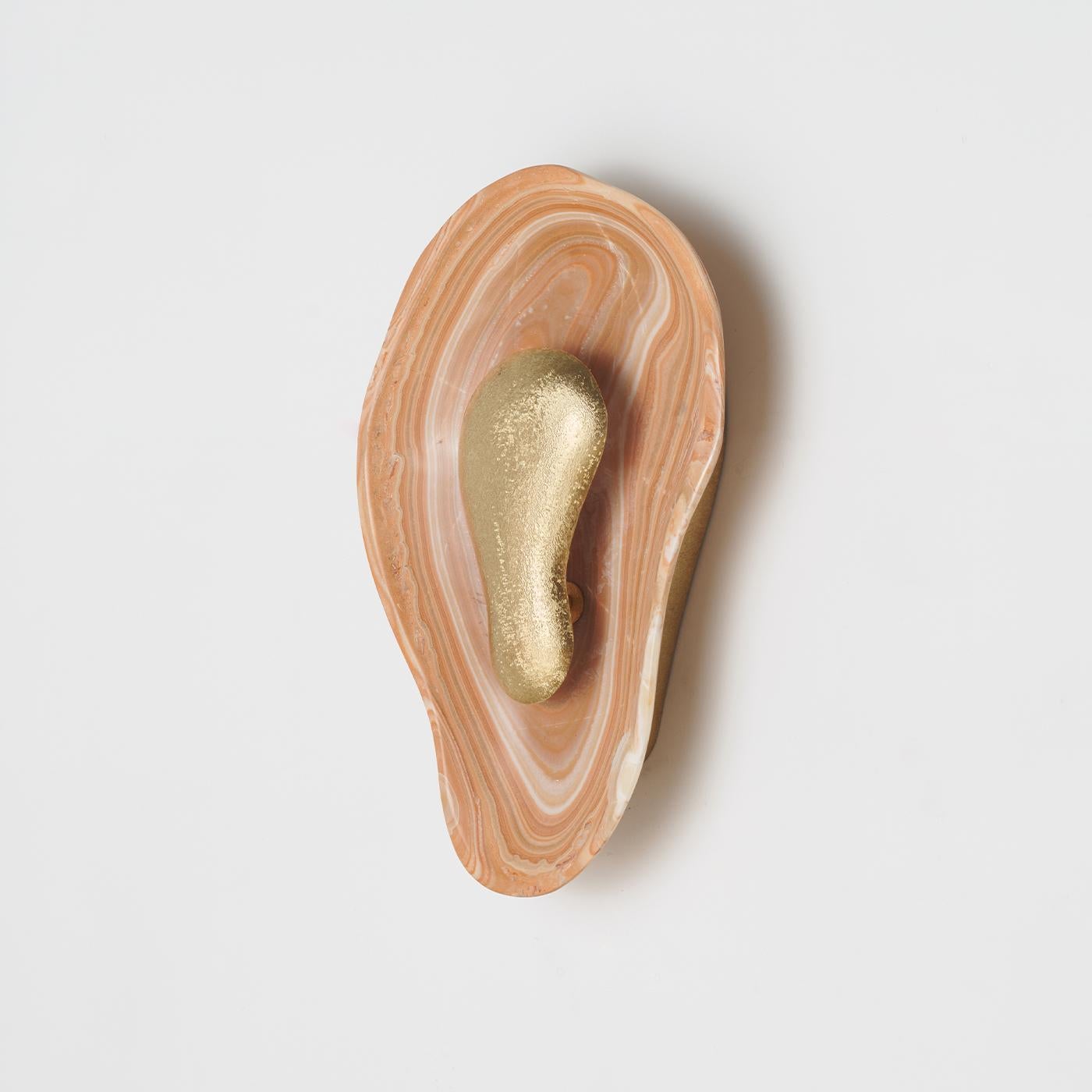 The sconce shown in a hallway, providing ambient lighting.