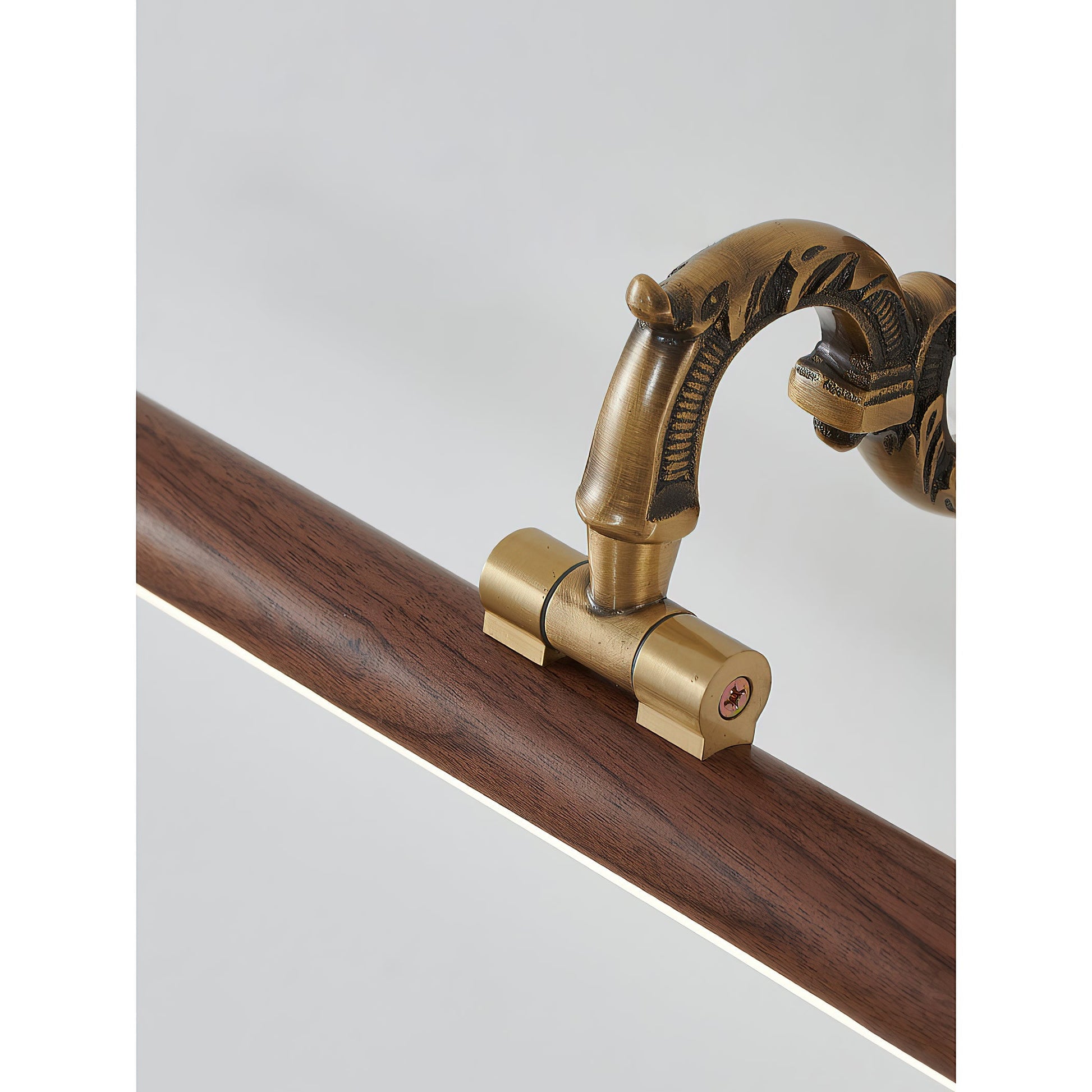 The brass picture light complementing a classic interior design.