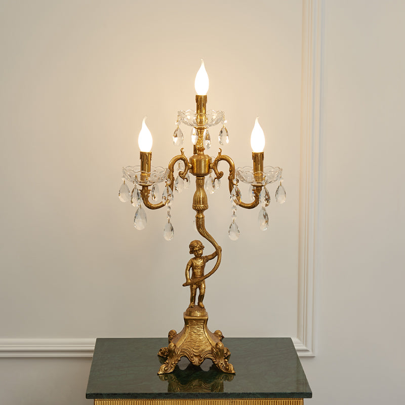 The table lamp placed on an end table next to a sofa.