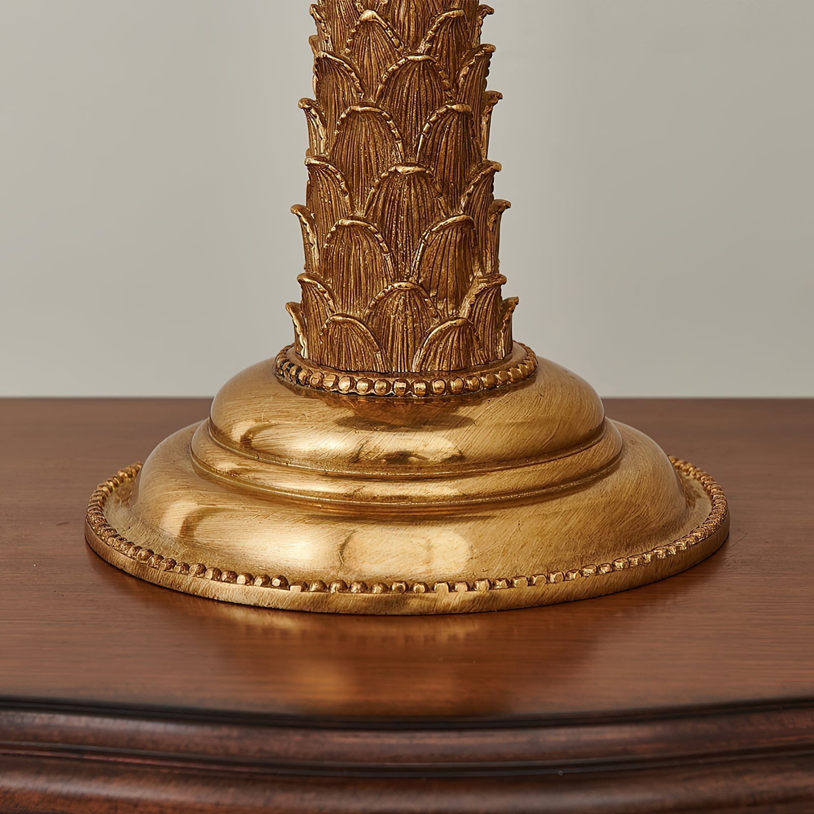 Detail of the brass finish on the lamp's stem.