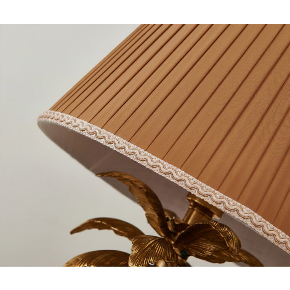 Another angle of the Palm Tree Table Lamp on a console table.