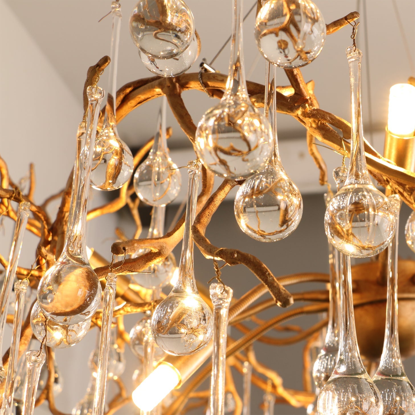 Detailed view of the intricate, hand-finished brass structure of the Palwa Chandelier.