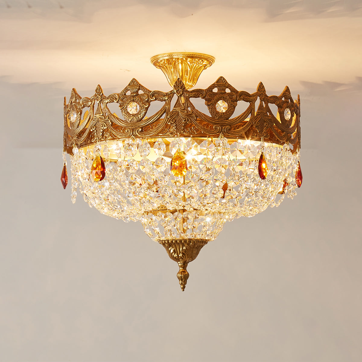 The chandelier casting beautiful light patterns on a nearby wall.